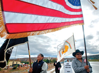 Marine Corps. Veteran and former Arizona State Representative Chris Deschene, left, and Steven Arviso, Right, vice president of Iyanbito Chapter lead a protest in Window Rock to the Navajo Housing Authority over longstanding grievances over housing issues. &copy; 2011 Gallup Independent / Adron Gardner 